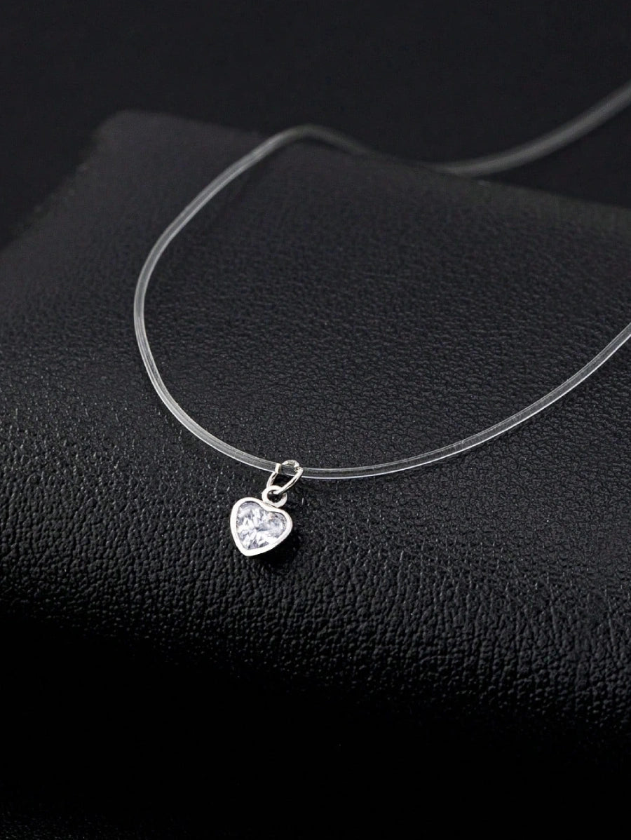 Дамско колие тип Чокър с прозрачна силиконова верижка и малка висулка - прозрачен кристал във формата на сърце.