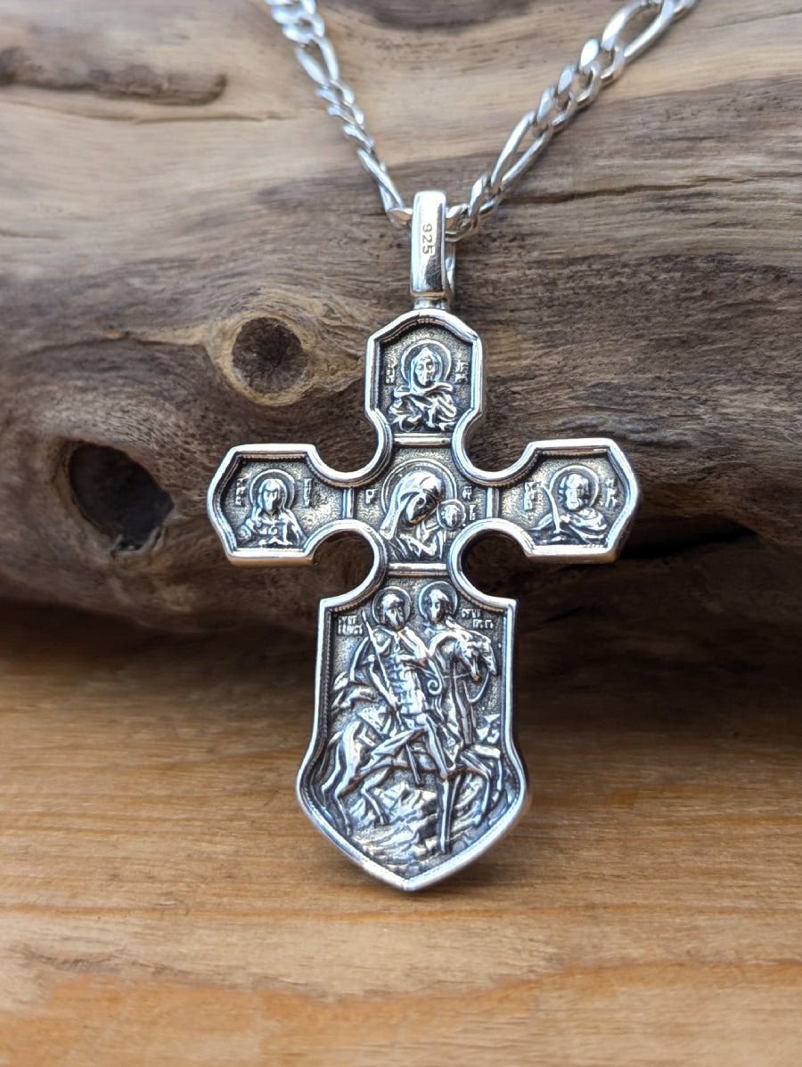 Сребърен православен кръст 925 с релефни икони и библейски сцени – обратна страна на двулицев медальон.